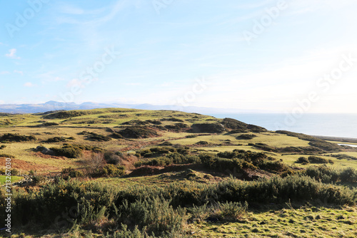 A view across open countryside towards Cardigan Bay, Criccieth, Gwynedd, Wales, UK.