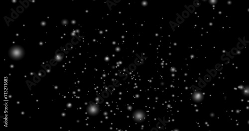 Cinematic snowfall loop animation of a surreal realistic snowflake falling bg. Snowfall winter overlay slowly falling motion graphic on a black backdrop.Snow flake for Christmas new year 2026,2025.