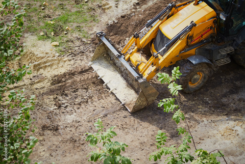 Fototapeta Bulldozer blade clearing construction site, Construction work