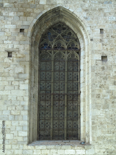 Old windows of a historical building in medieval european city