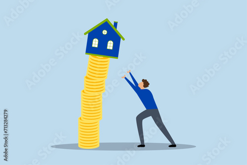 Property market collapse, real estate agent helps protect the house from a falling unstable stack of coins.