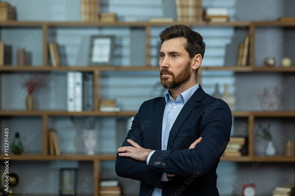 A seasoned professional stands with poise in his elegant office, exuding confidence as he ponders business strategies. A seasoned professional stands with poise in his elegant office, exuding confidence as he ponders business strategies.