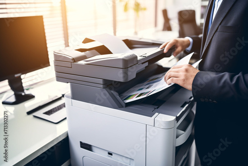 Businessman print paper on a multifunction laser print
