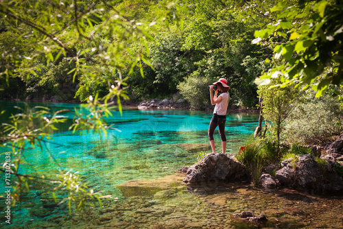 Female Adult Tourist Photographer Enjoying the Beauty of nature of Lake Cornino