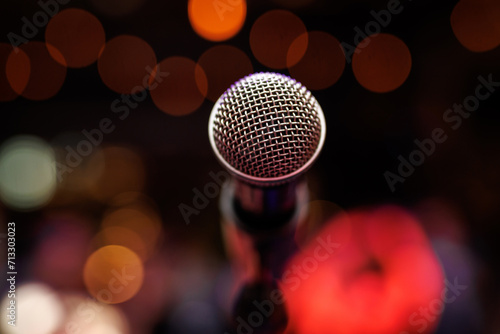 Close-up of microphone in concert hall or stand up club.