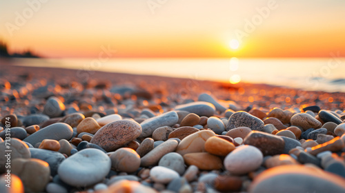Glittering pebbles glimmer in the hazy sundown hues on the nearby coastline.