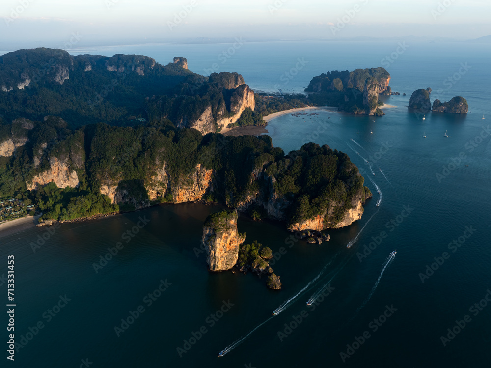 View from above, stunning aerial view of the Ao Nang coast at sunset with the Ao Nang Tower, Tonsai beach and Railay Beach in the distance, Krabi, Thailand.