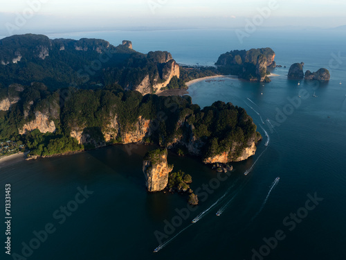 Obraz na płótnie View from above, stunning aerial view of the Ao Nang coast at sunset with the Ao Nang Tower, Tonsai beach and Railay Beach in the distance, Krabi, Thailand. w salonie