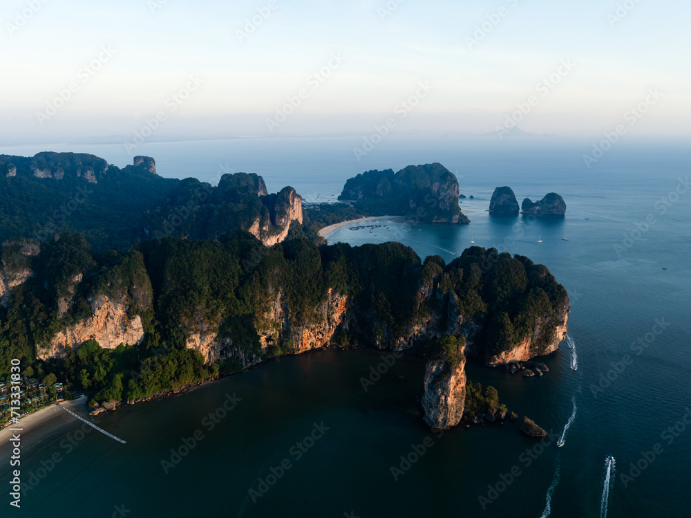 View from above, stunning aerial view of the Ao Nang coast at sunset with the Ao Nang Tower, Tonsai beach and Railay Beach in the distance, Krabi, Thailand.