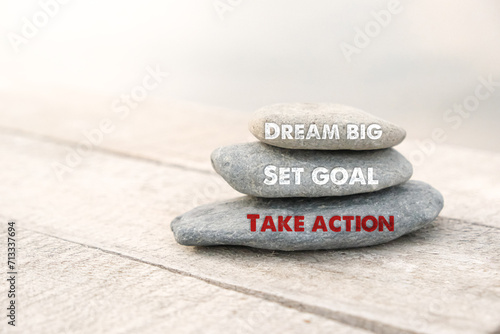 Dream big  set goal and take action. Motivational advice or reminder  on the stones
