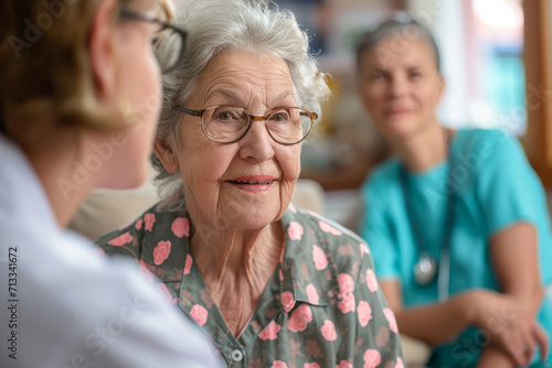 Elderly Woman Receiving Care And Support From Healthcare Professional And Caregiver