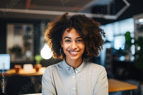 Portrait of a smiling young African American woman in modern office