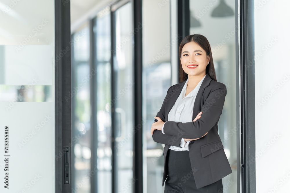 Asian Businesswoman using smartphone for doing finance on an office desk, tax, report, accounting, statistics, and analytical research concept. Asian Businesswoman using smartphone for doing finance on an office desk, tax, report, accounting, statistics, and analytical research concept.