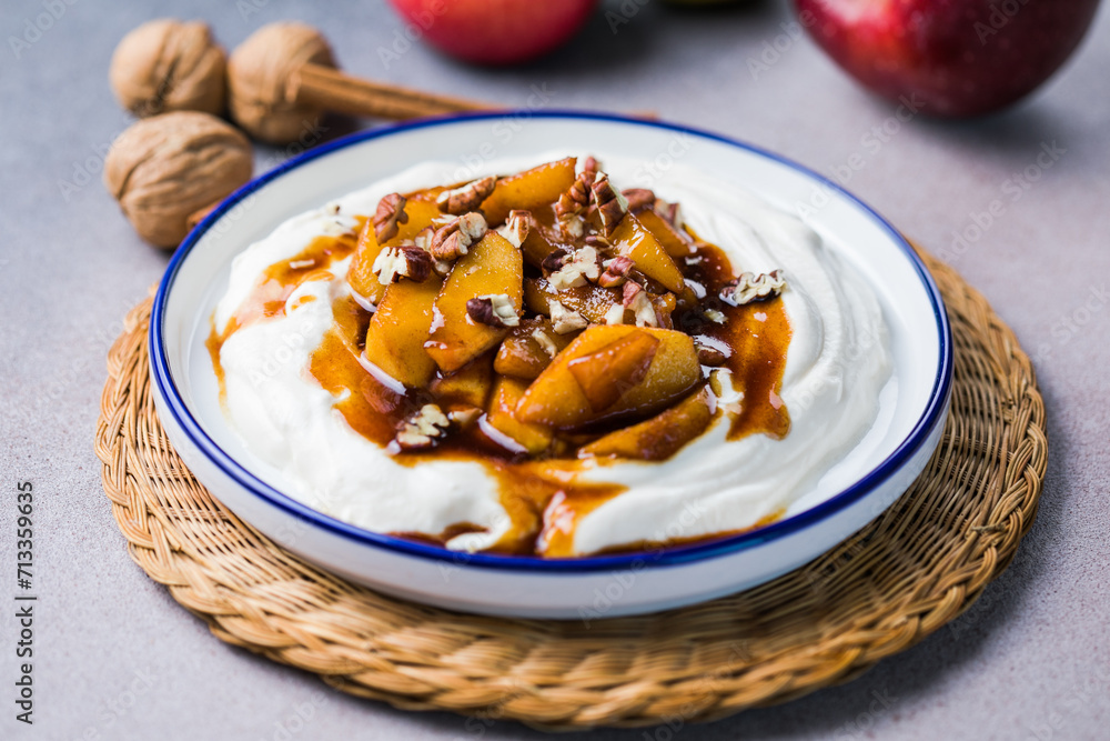 Labneh yogurt cream cheese with roasted apples, copy space. Traditional arabian or middle eastern homemade labneh dip. Greek yogurt. Labneh yogurt cream cheese with roasted apples, copy space. Traditional arabian or middle eastern homemade labneh dip. Greek yogurt.