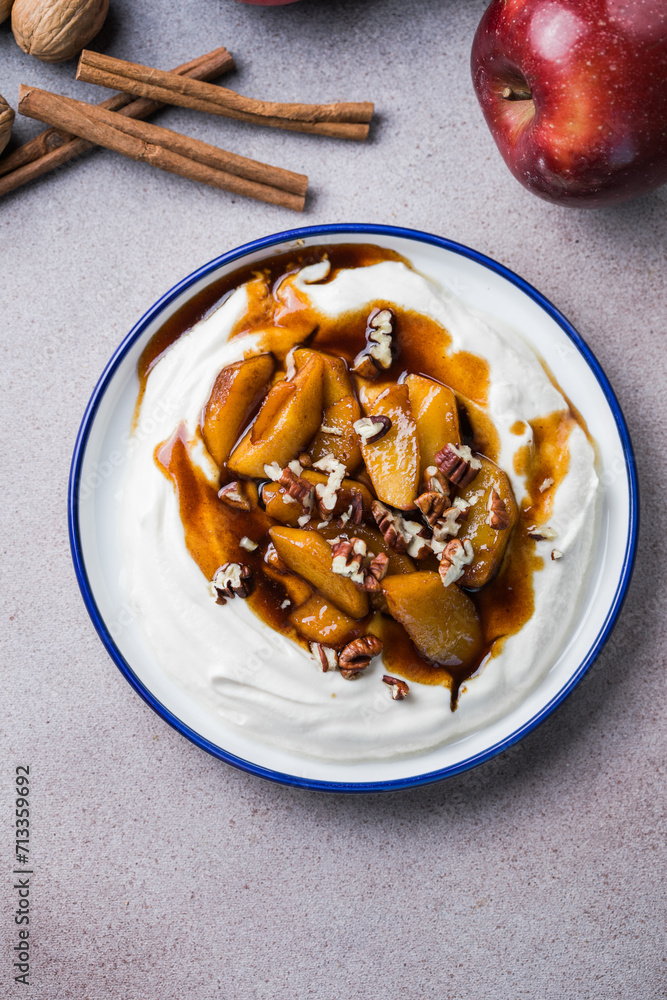 Labneh yogurt cream cheese with roasted apples, copy space. Traditional arabian or middle eastern homemade labneh dip. Greek yogurt.