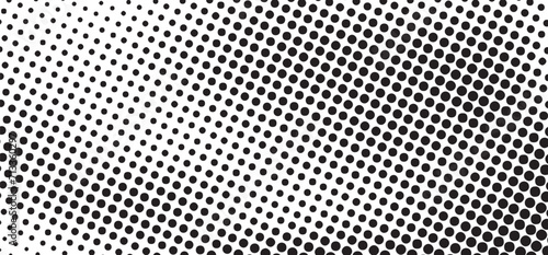 Black and white dotted halftone background. Grunge halftone vector background in black and white colors. Distressed overlay texture photo