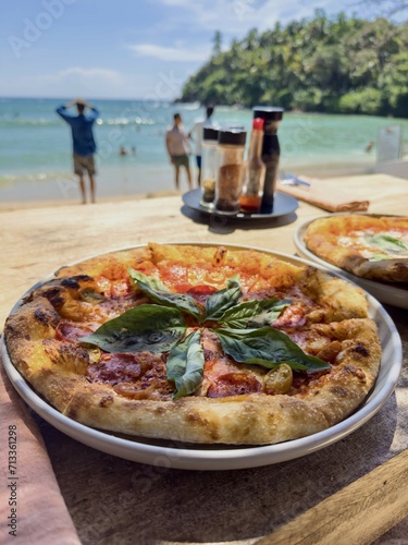 Seaside Slice Delight: A Taste of Paradise with Pizza by the Waves.This photo was taken by my iPhone 15 Pro and edited by me.