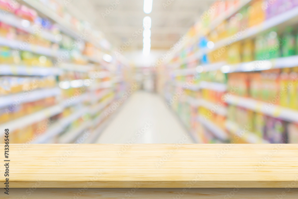 Empty wood table top with supermarket blurred background for product display