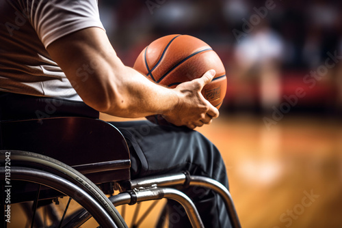 A man in wheelchair playing basketball photo