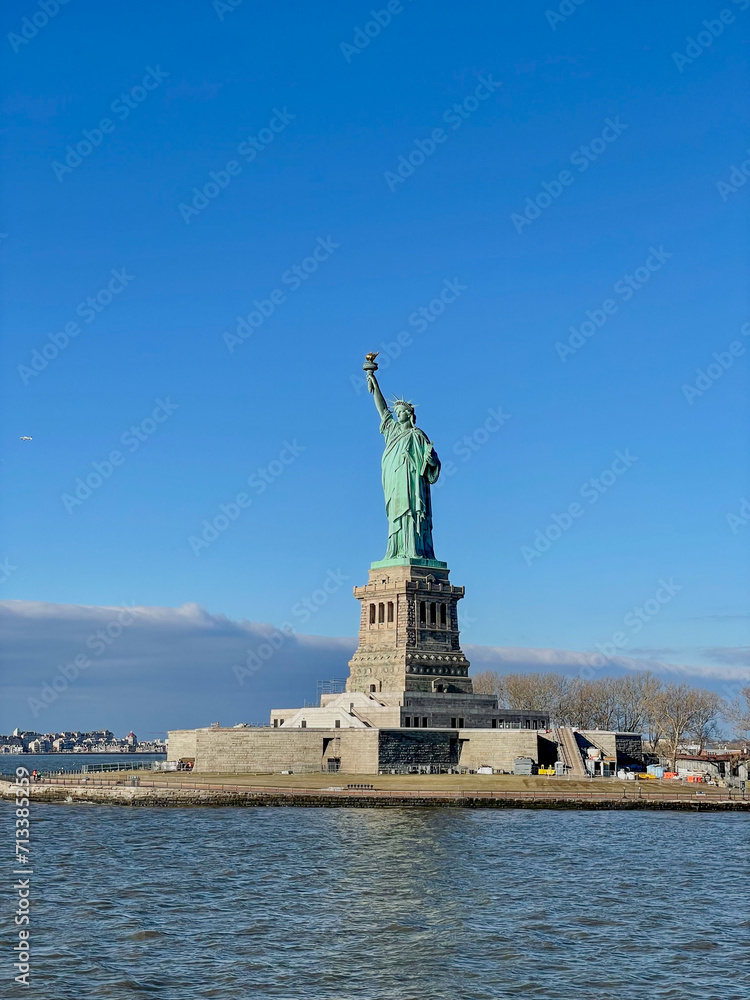 New York, New York – January 11, 2024: the view of the Statue of Liberty from the ferry boat with tourists