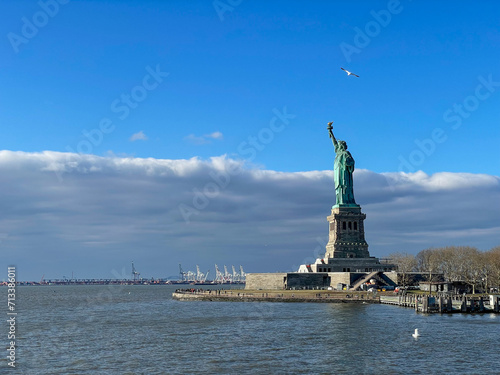 New York, New York – January 11, 2024: the view of the Statue of Liberty from the ferry boat with tourists