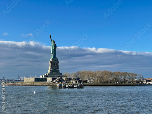 New York, New York – January 11, 2024: the view of the Statue of Liberty from the ferry boat with tourists
