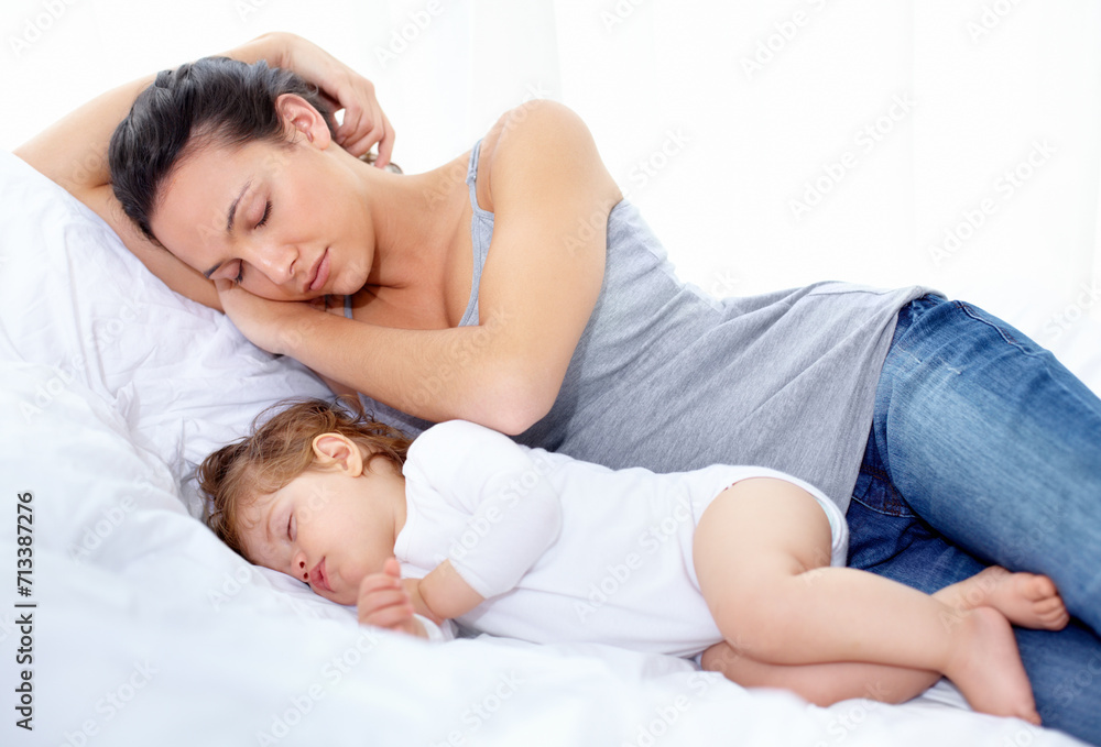Mother, baby and sleeping on bed together for calm break, peace and dreaming to relax at home. Tired mom, young kid and asleep for newborn development, healthy childhood growth and cozy nap for rest Mother, baby and sleeping on bed together for calm break, peace and dreaming to relax at home. Tired mom, young kid and asleep for newborn development, healthy childhood growth and cozy nap for rest