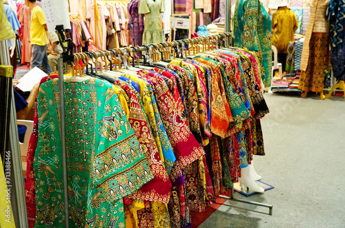 Colorful Clothes hanging for sale in the shop