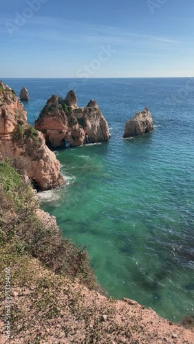 Bird eye shot of the coast,  turquoise water with rocks formation 