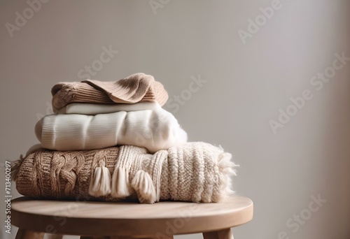 folded sweaters and clothes stacked on top of each other photo