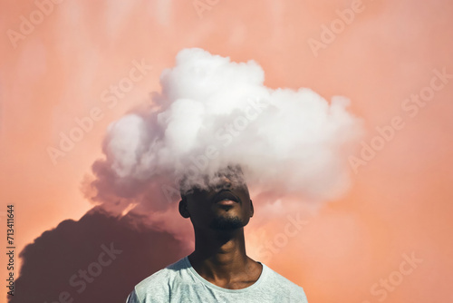 An evocative portrait of a person with a cloud obscuring their head, with sunset hues in the background photo