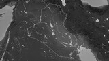 Iraq outlined. Grayscale elevation map