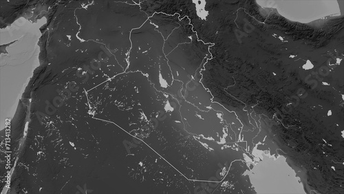 Iraq outlined. Grayscale elevation map