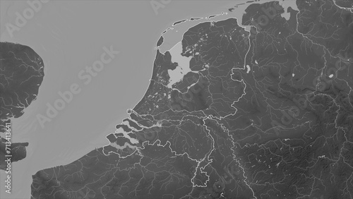 Netherlands outlined. Grayscale elevation map