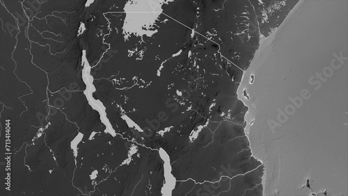 Tanzania outlined. Grayscale elevation map