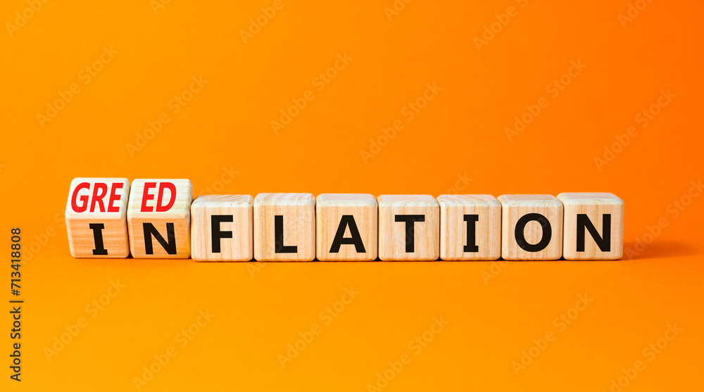 Inflation or greedflation symbol. Concept word Inflation Greedflation on beautiful wooden cubes. Beautiful orange table orange background. Business inflation greedflation concept. Copy space. Inflation or greedflation symbol. Concept word Inflation Greedflation on beautiful wooden cubes. Beautiful orange table orange background. Business inflation greedflation concept. Copy space.