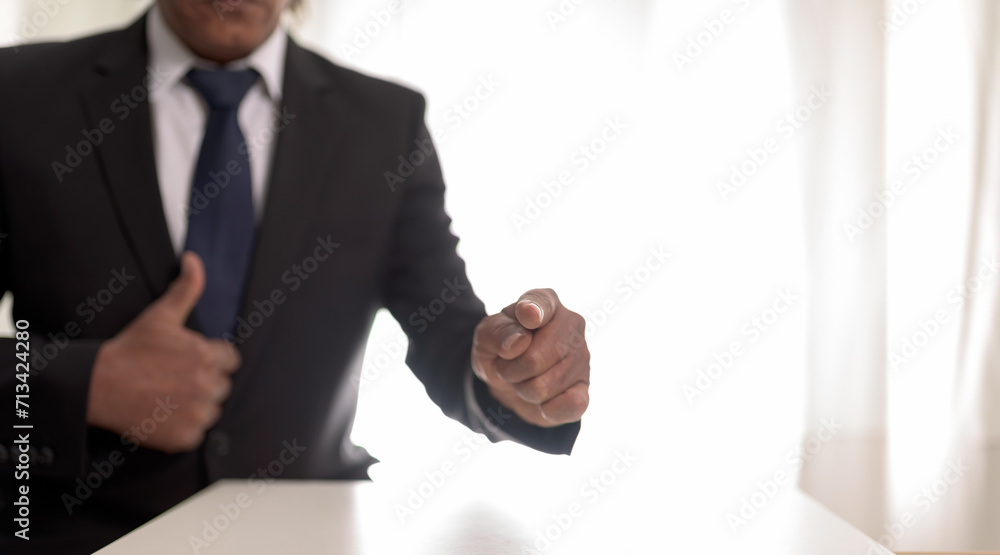 Businessman showing a new goals concept ,blur man fingers on focus. Businessman showing a new goals concept ,blur man fingers on focus.