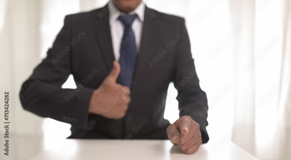 Businessman showing a new goals concept ,blur man fingers on focus. Businessman showing a new goals concept ,blur man fingers on focus.