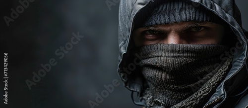 Criminal businessman wearing balaclava in office. Copy space image. Place for adding text photo