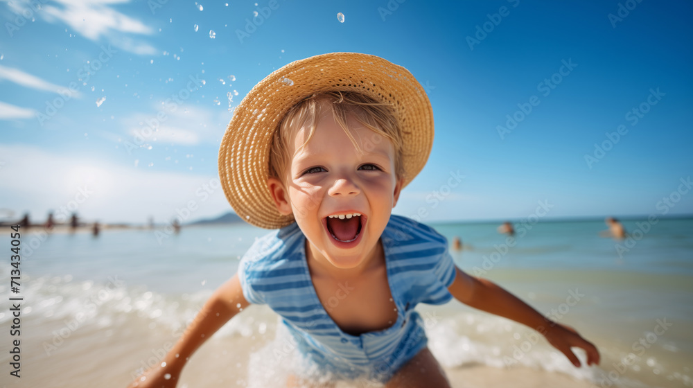 a little boy with the hat joyfully having a great time on a sunny beach during a warm day. toddler on the beach at summertime with copy space