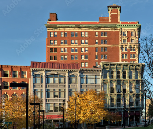 view of downtown Binghamton buildings at sunset golden hour (historic architecture including the press building on court street and chenango) autumn colors at dusk small town, city upstate new york NY #713446041