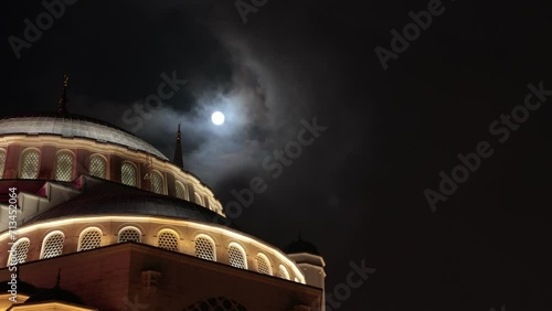 Islamic concept 4k video. Dome of a mosque and full moon at night. Ramadan or laylat al-qadr or kadir gecesi concept footage with copy space for text.