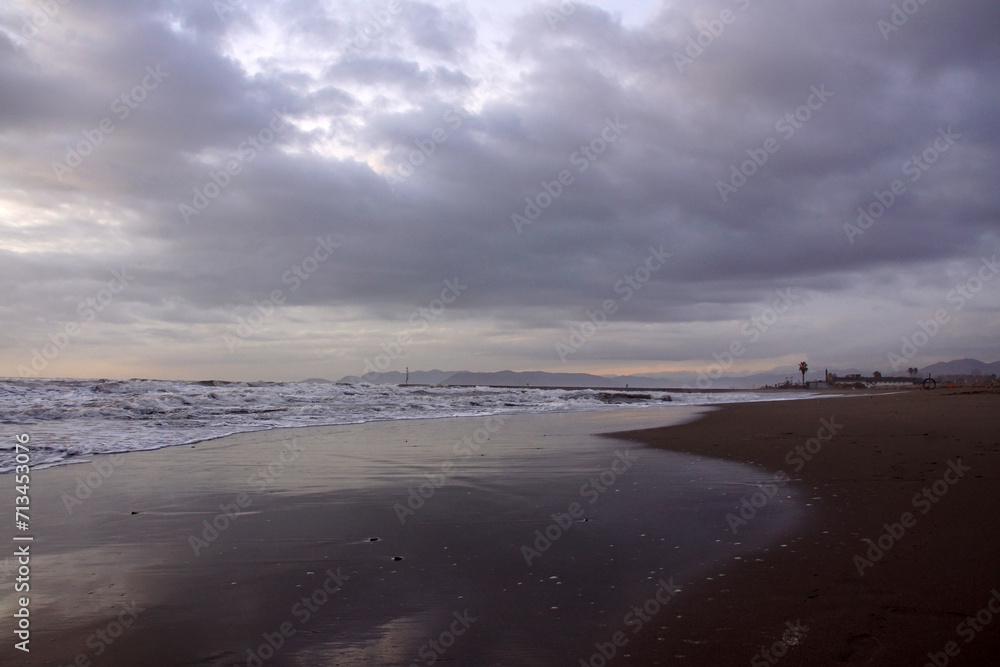 beach in the winter with clouds