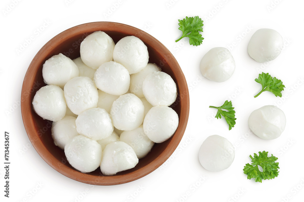 Mini mozzarella balls with parsley in a ceramic bowl isolated on white background. Top view. Flat lay. Mini mozzarella balls with parsley in a ceramic bowl isolated on white background. Top view. Flat lay.