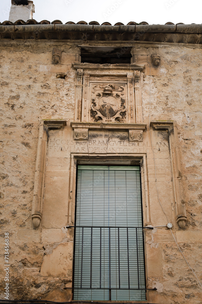 Coat of arms made of carved stone in the old town of Priego