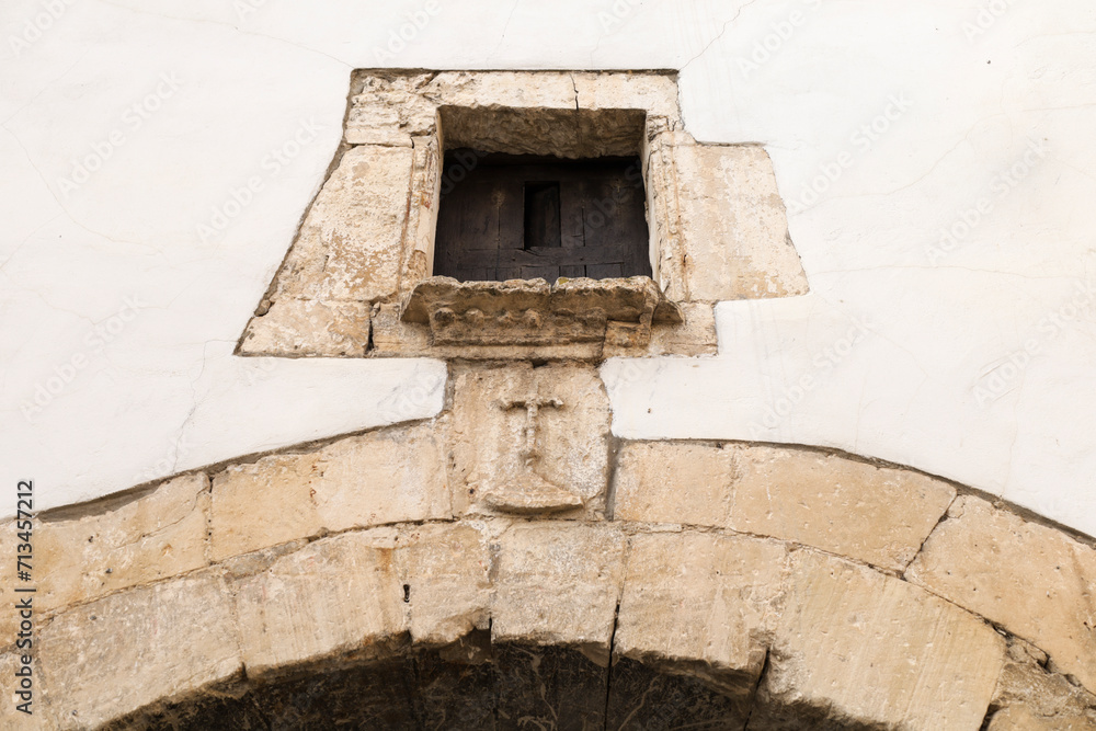 Coat of arms made of carved stone in the old town of Alarcon