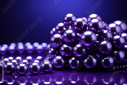  a bunch of shiny balls sitting next to each other on a purple surface with a reflection of them on the surface.