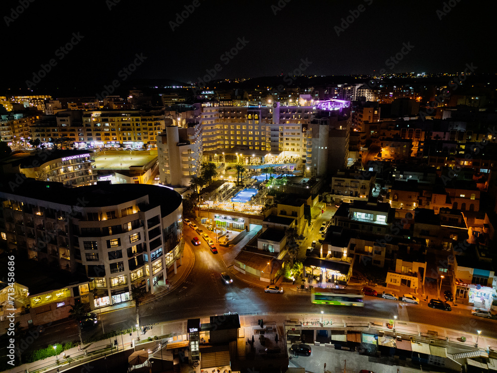 Hotels at night aerial view of illuminated St Paul's Bay Malta from the sea. Date: 25.10.2023 St. Paul's Bay, Malta Hotels at night aerial view of illuminated St Paul's Bay Malta from the sea. Date: 25.10.2023 St. Paul's Bay, Malta