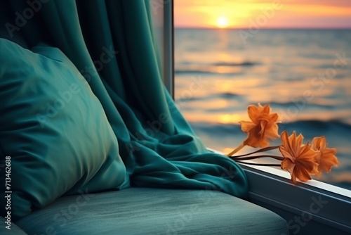  a close up of a window with a view of a body of water and a flower on the window sill.