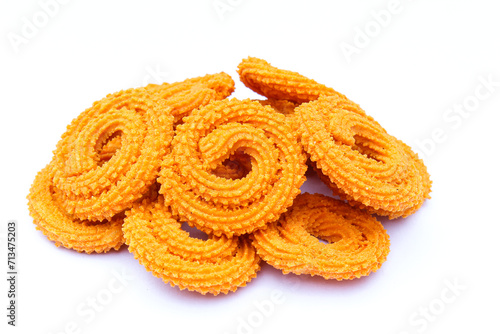 Indian snacks food murukku on white background side view 
